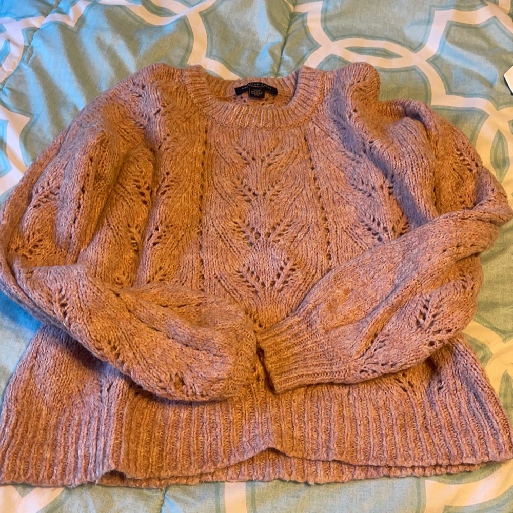 Pink sweater.